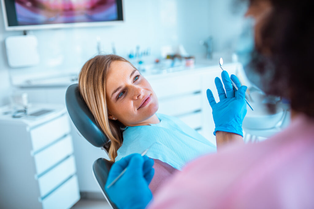 dentist reviewing a tooth extraction option with a patient in Lexington, SC